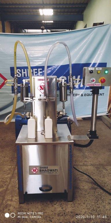Semi automatic two head volumetric liquid filling machine