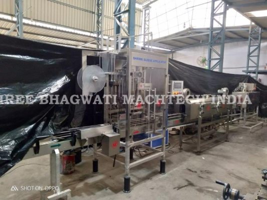 Liquor-bottle-shrink-sleeve-applicator-with-Steam-tunnel-with-hot-air-tunnel